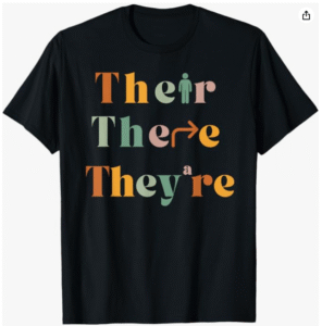Black T-shirt printed with the words “Their There They’re” — a homophone joke about common grammar mix-ups.